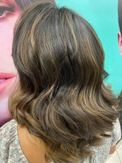 A back view of a balayage on a lob. You can see how the highlights are concentrated towards the ends, which allows for a very graceful and low-maintenance grow-out period.