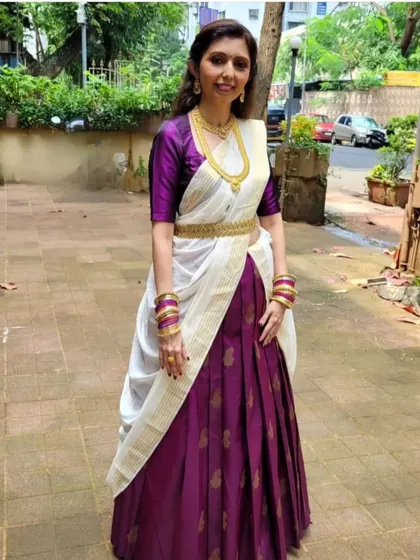 Here, I have combined a Kanjeevaram and a Kasavu saree to create a unique half-saree or lehenga look. This demonstrates how you can mix and match sarees for a truly personalized style.