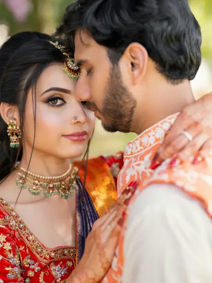 A close-up couple's portrait from their engagement. The makeup is soft and pretty, perfect for this happy and intimate moment.