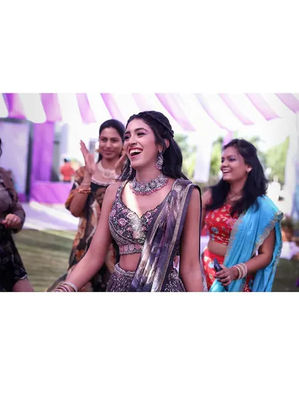 The bride's infectious laugh as she dances with her friends and family at her Mehendi ceremony.