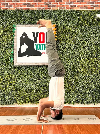A student demonstrating incredible control in this Tripod Headstand variation. Seeing my students find stability and grace upside down is a highlight of my teaching.