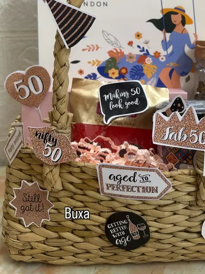A close-up of the "Fifty & Fabulous" hamper, showing the fun, glittery cutouts and the Yardley London gift set in the background.