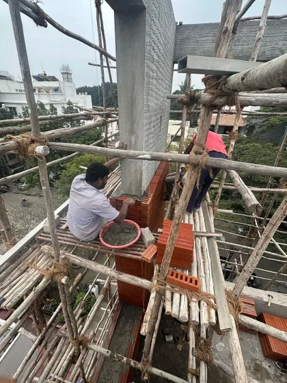 A series showing masons meticulously laying bricks for a facade. Achieving a perfect finish requires incredible skill and patience, and we have immense respect for the craftspeople who bring our designs to life.
