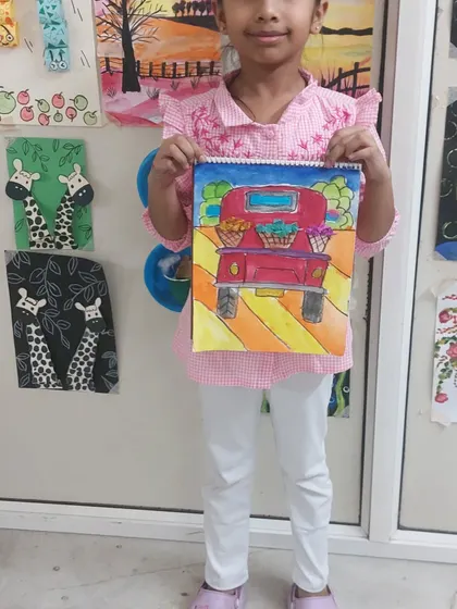 This student's vibrant painting of a truck filled with flowers is so cheerful. I love seeing the unique color choices each child makes.