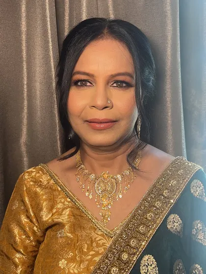 Makeup for mature skin is about enhancing, not hiding. For this lovely client attending a wedding, I focused on creating a luminous glow with a soft, smudged liner and a touch of shimmer to let her natural beauty shine with elegance.