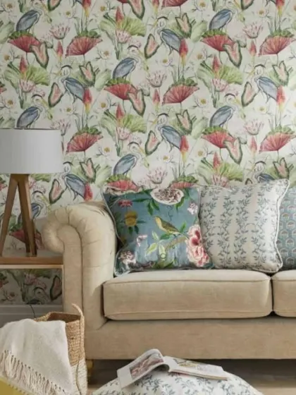 Here is the heron wallpaper in a living room setting, showing how it can be paired with other patterns and textures for a layered, designer look.