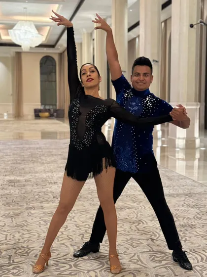 A series of photos from a professional performance in Abu Dhabi. These shots capture the different poses, lines, and moments from our polished Salsa duet, highlighting our performance costumes and stage-ready look.