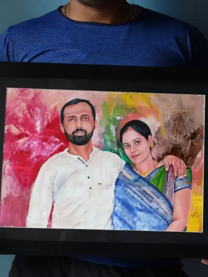 A framed oil portrait of a couple set against a modern, abstract background. The contrast between the realistic figures and the expressive backdrop adds a contemporary touch to the piece.