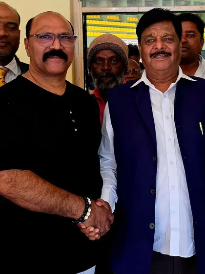 Meeting with Dr. H.C. Mahadevappa, the Social Welfare Minister of Karnataka, at a National Level Karate Tournament in Mysore. I appreciate his support for the sport.