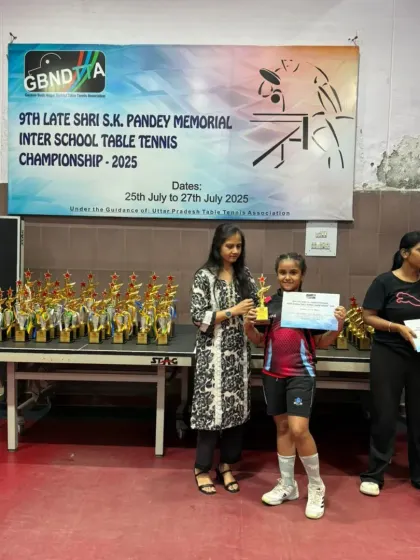 Another one of our talented players receiving her award at the GBN Interschool Championship. The table full of trophies in the background is a familiar sight at tournaments our players attend.