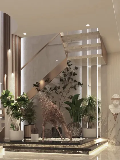 This image captures the intricate details under a staircase, transformed into a beautiful decor element with plants and sculptures. It shows my belief that no corner should be overlooked in a luxury home.