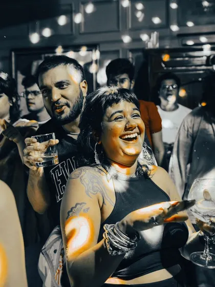 Laughter and good times. A candid shot of guests enjoying the party atmosphere.