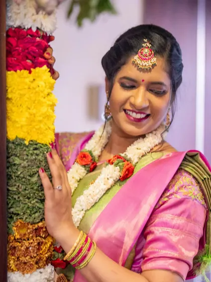 Elegance in every shade. This was the second look for her housewarming ceremony, featuring a beautiful pink and green saree complemented by fresh, glowing makeup and a happy smile.