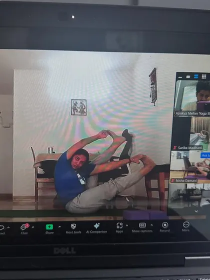 A student works on a seated hip opener during our live Zoom session. I make sure to give individual feedback to everyone in the class.