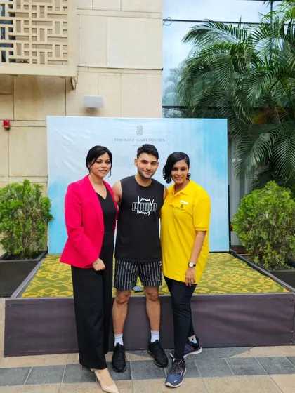 Posing with participants after a successful Zumba session for World Wellness Weekend. I always make time to connect with the people I teach.