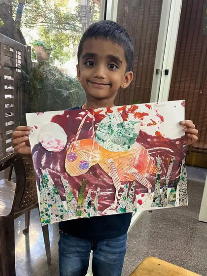 This textured artwork was made using printing and collage techniques. It's a great example of how we encourage kids to experiment by combining different art forms.