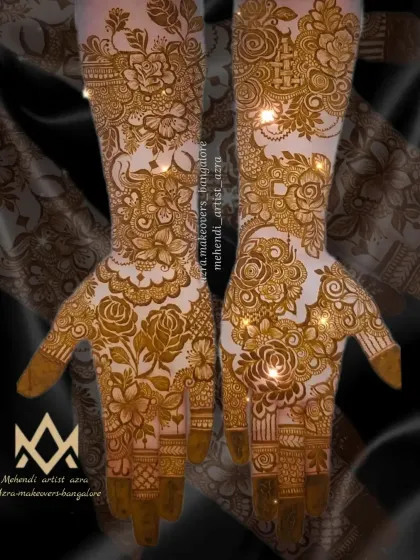 A non-bridal Arabic mehendi design with a yellow tint, showing the fresh henna paste before it dries and darkens.