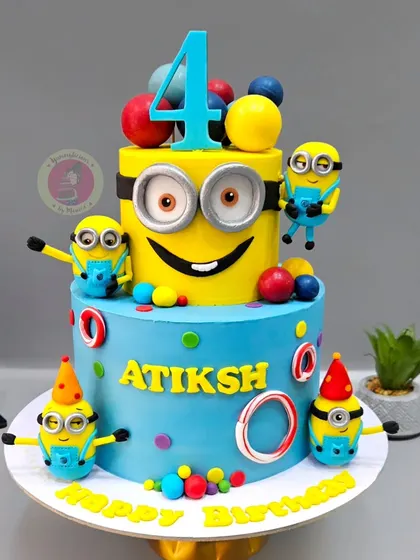This vibrant two-tier Minions cake is pure happiness. With multiple handcrafted, playful Minion figurines, it’s a perfect example of how we bring beloved characters to life for a child's special day.