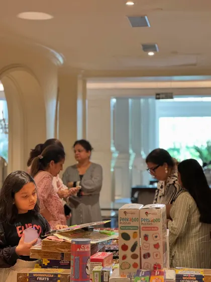 Young shoppers are captivated by the fun and engaging products available at the kids' section of the exhibition.