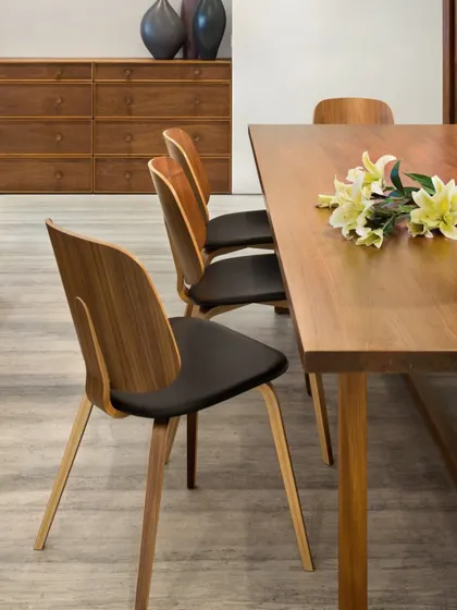 A detail shot of the dining chairs in the Limestone Residence, showcasing their curved wooden backs and simple, elegant form. This is an example of our belief in the beauty of well-crafted, functional objects.