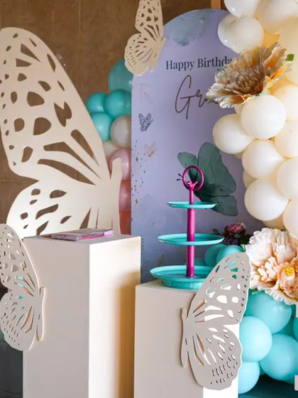A close-up view of the large butterfly wing prop, a signature element in my butterfly-themed parties. These custom pieces serve as fantastic photo opportunities for guests.