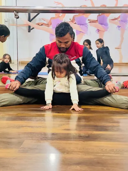 It all starts with flexibility, even for my youngest students. This little gymnast is only three years old and is already learning how to stretch correctly with my help. We make it safe and fun for them.