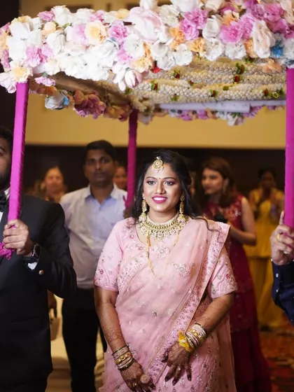 The grand entrance. This bride looks radiant and confident as she enters her engagement ceremony, with her makeup looking flawless.