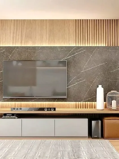 A close-up of the entertainment unit, featuring a dark marble-style back panel and a combination of open and closed storage.