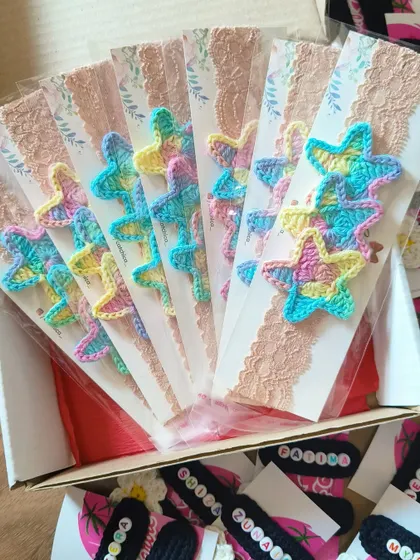 Packing a bulk order of our newborn star headbands, a popular choice for baby shower gifts and party favors.