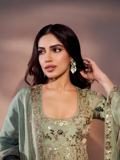 A close-up of Bhumi's mint green Anarkali, highlighting the intricate embroidery on the bodice.