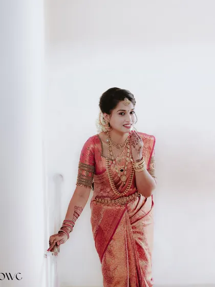 A sweet and shy smile from the bride, captured in a simple and elegant portrait.