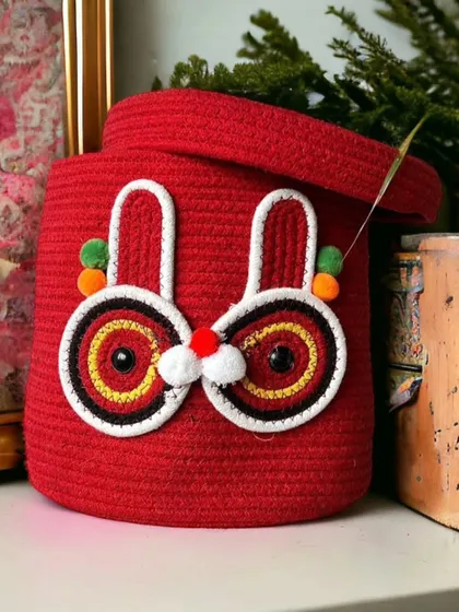 This quirky red rabbit basket is a fun way to store your child's favorite things. The bright color and playful design make it a standout piece.