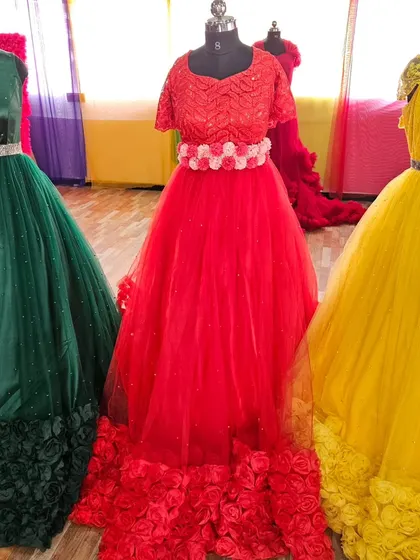 A closer look at the red and yellow rose-hem gowns from our collection.