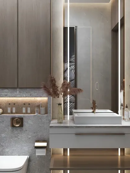 A sophisticated bathroom design with grey textured walls and a floating vanity. The backlit mirror and niche shelving provide both function and beautiful ambient light.