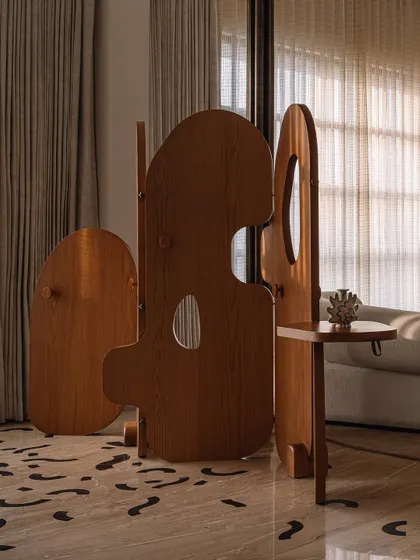 The 'Hide'n'Seek' screen from our MuseMART collection, a playful and functional piece of furniture that acts as a space divider.