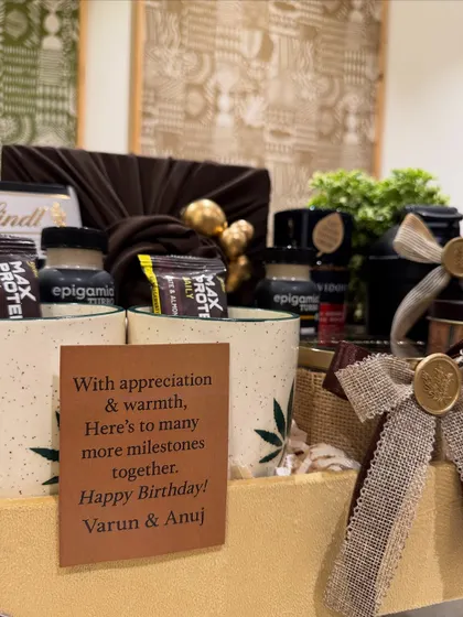 The personalized birthday card for Varun and Anuj reads, "With appreciation & warmth, here's to many more milestones together." It shows how we tailor our messages to reflect the relationship and occasion.