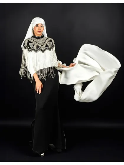 Another angle from our modest fashion series, this time capturing the fabric in mid-air. This technique adds life and energy to the studio portrait.