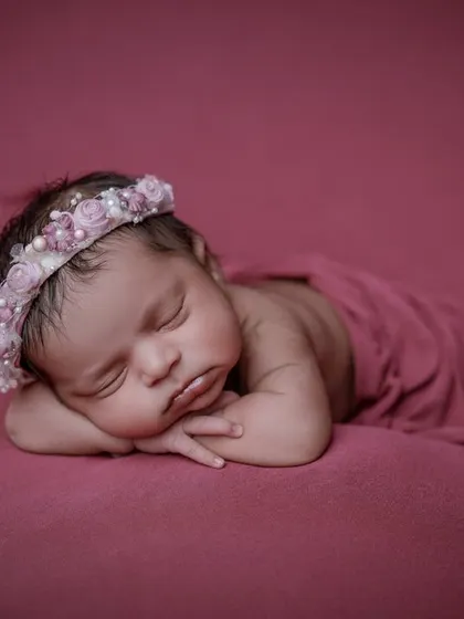 Tiny fingers, tiny toes. This classic close-up of a sleeping baby's face is a must-have for any newborn gallery.