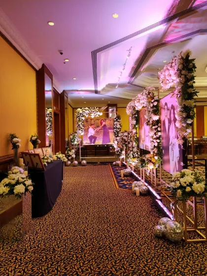 A full view of the personalized photo gallery walkway. This immersive entrance allows guests to feel connected to the couple's story as they make their way into the reception.