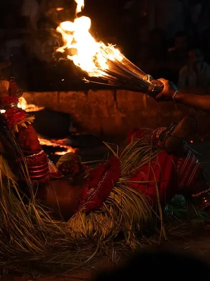 A series capturing the different stages of the Pottan Theyyam ritual, from the performer lying on the embers to being tended to by assistants. These images show the intensity and devotion involved in the all-night ceremony.