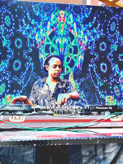 A wide shot of my stage setup, showing the large LED screen and lighting rig. This is the kind of professional production you can expect at my festival gigs.