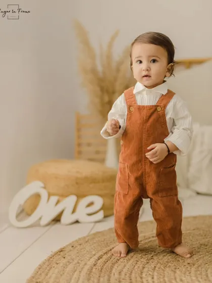A proud moment as the birthday boy stands on his own. We capture all these big firsts during our milestone sessions.