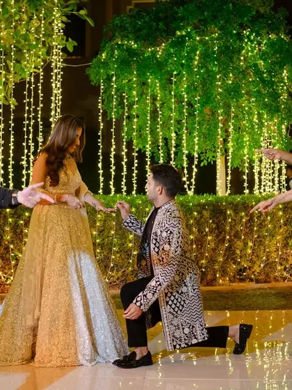 A groom proposes to his bride mid-performance, a surprise moment we helped plan. We love adding personal touches to your sangeet.