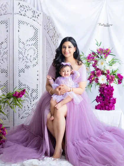 A mother and her baby girl in matching lavender dresses. My client closet includes beautiful gowns for moms and coordinating outfits for babies.