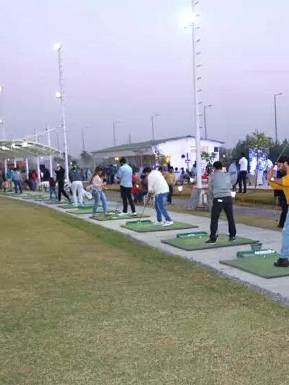 Every day is a golf day here. A wide view of our hitting bays, busy with players enjoying the evening.