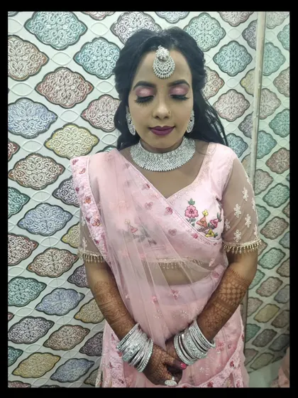 A lovely engagement look with shimmery pink eyeshadow and a diamond-style jewelry set. The makeup is glamorous yet elegant, perfect for the occasion.