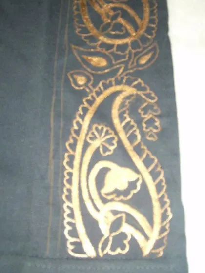 A detailed shot of the hand-painted paisley design. You can see the intricate floral patterns within the motif, all done with fabric paint to ensure it is washable and durable.