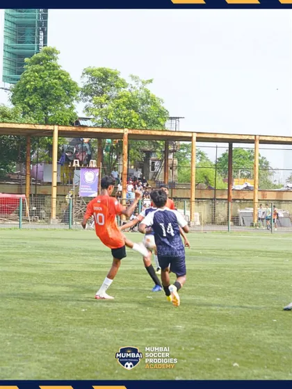 A player strikes the ball during a hard-fought U15 semi-final match.