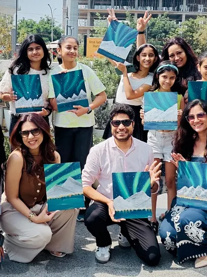 A happy group of painters with their finished Northern Lights canvases. It's always a joy to see a room full of unique interpretations of the same theme.