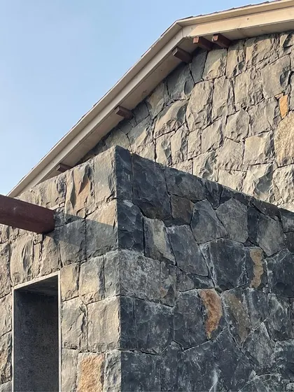 A detail of the basalt stone masonry at Ranch House. We believe in using local materials honestly, and this rough, textured wall is a key feature of the project's design.